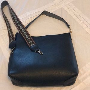 Reversible bucket tote with crossbody strap